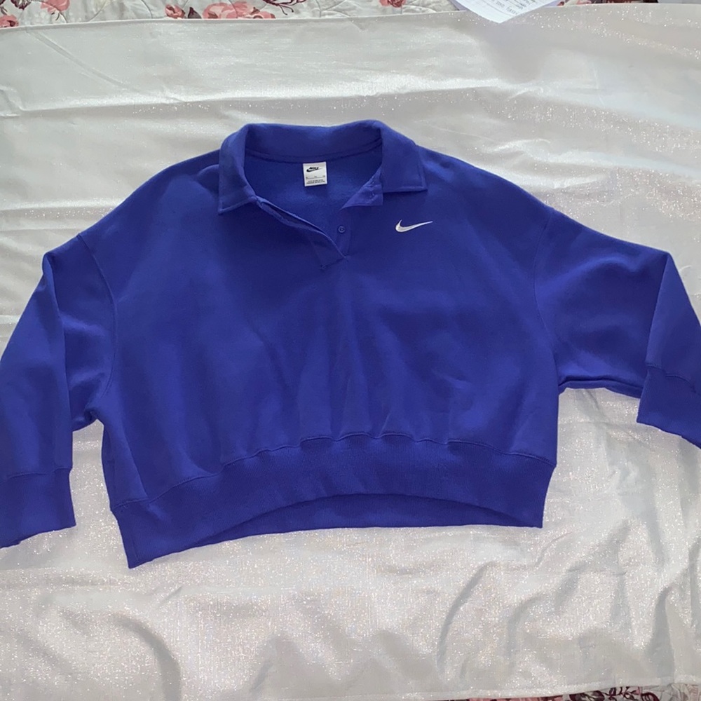 Blue Nike crew neck jacket.